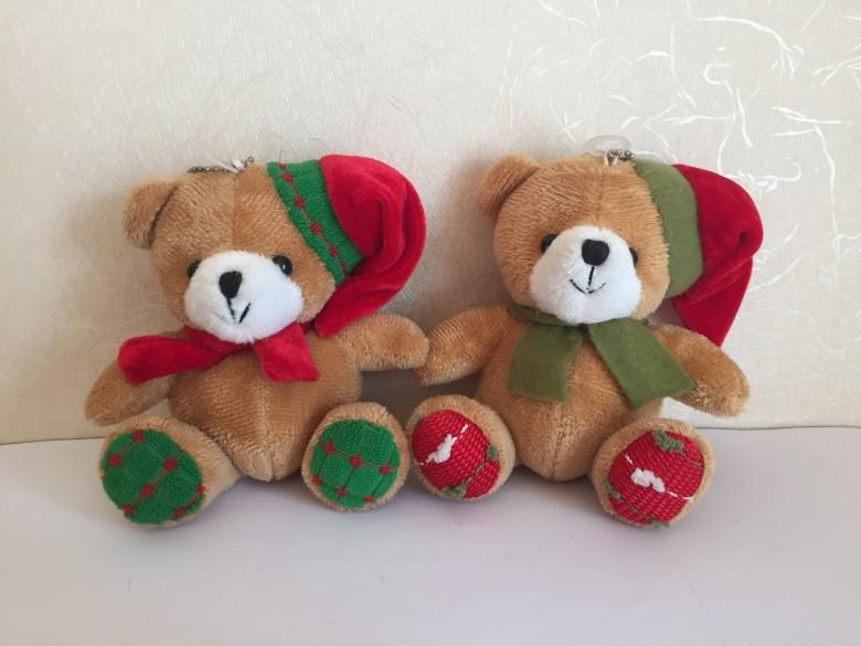 stuffed bear with christmas scarf and hat